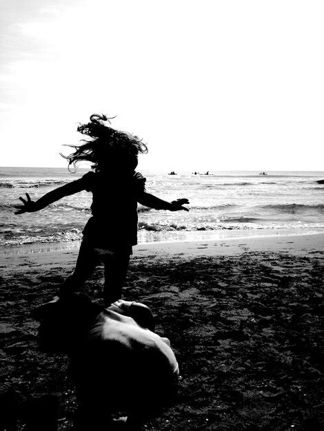 Premium Photo | Silhouette of children playing on beach