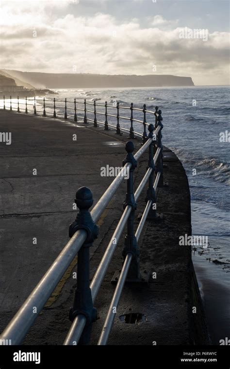 Sunset over Whitby beach on the North Yorkshire coast Stock Photo - Alamy