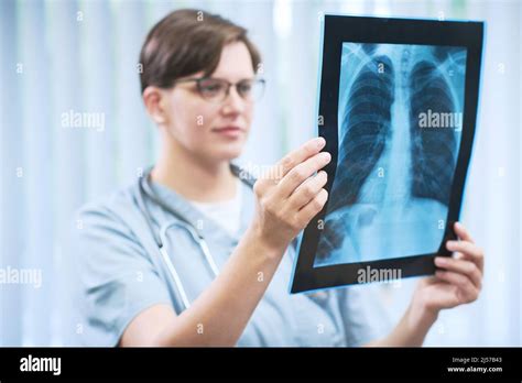 Radiologist Holding Chest X Ray Image While Examining Lungs Before