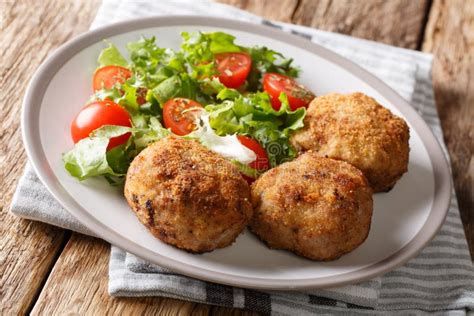 Tasty Danish Pork Minced Meat Patties In Breading With Fresh Veg Stock