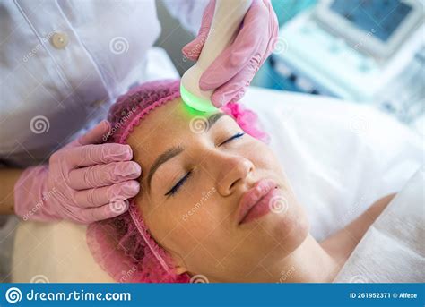 Girl At An Appointment With A Beautician Is Doing An Ultrasonic Face