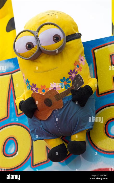 Minions soft cuddly toy playing guitar on fairground stall Stock Photo ...