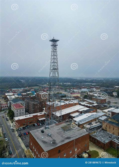 View of Bustling Modern City Skyline with a Tower on an Overcast Day ...