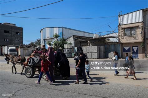 Palestinians flee their homes in Gaza City, on Oct. 13, 2023. Israeli ...