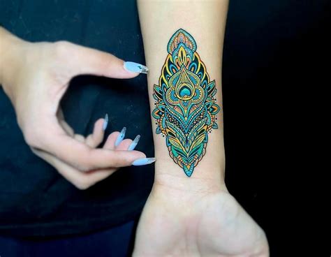 Share 89 About Wrist Peacock Feather Tattoo Super Hot