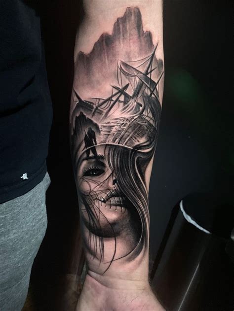 a woman's arm with a ship on it