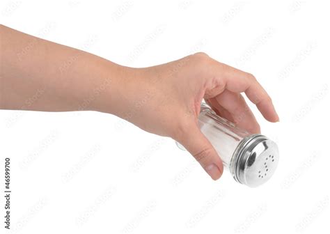 Female Hand Pouring Salt From Salt Shaker Stock Photo Adobe Stock