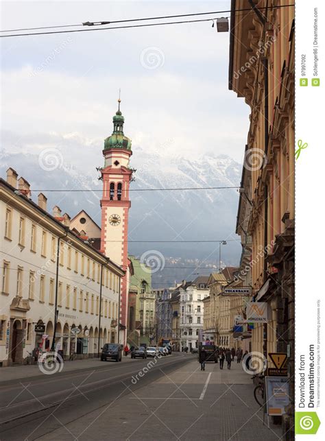 Innsbruck Cityscape With Church Spire And Snow Mountains Editorial