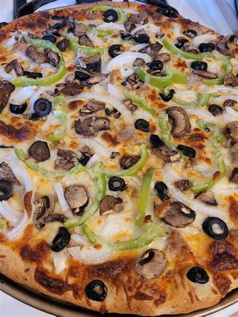 Homemade Pizza Sausage Onion Green Pepper Mushrooms And Black Olive