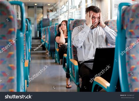 Tired Businessman Under A Lot Of Stress On The Train Stock Photo