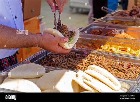 Man Hands Making Gyro Into Pita Stock Photo Alamy