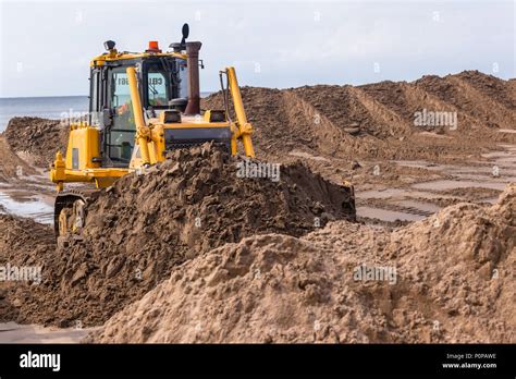 Earthworks Construction Heavy Dozer Machine Pushing Sand Closeup Photo