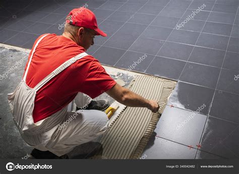 Floor ceramic tiles installation. Create, arranging. Stock Photo by ...