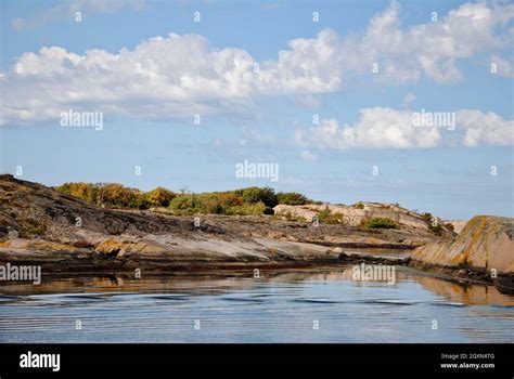 Reflections of clouds in calm sea in Fjällbacka archipelago on the