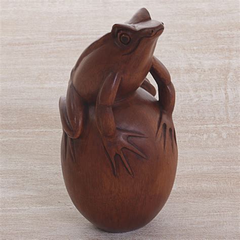 Hand Carved Suar Wood Frog on Pebble Sculpture - Proud Frog | NOVICA