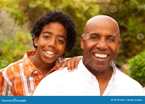 African American Father And Son Talking And Laughing Stock Photo