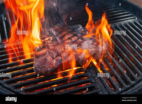 Barbecue Dry Aged Wagyu Porterhouse Beef Steak Grilled As Close Up On A