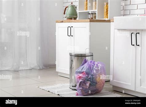 trash bin  full garbage bag  interior  modern kitchen stock
