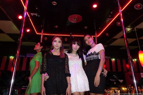 Mature Amateur Asian Shemales Pause To Pose At Bankok Ladyboy Club