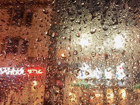 "Rainy Night Car Window" by Stocksy Contributor "Jeff Wasserman" - Stocksy