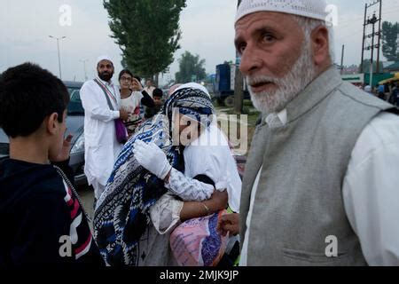 A Kashmiri Muslim Pilgrim In White Kisses A Relative As She Leaves