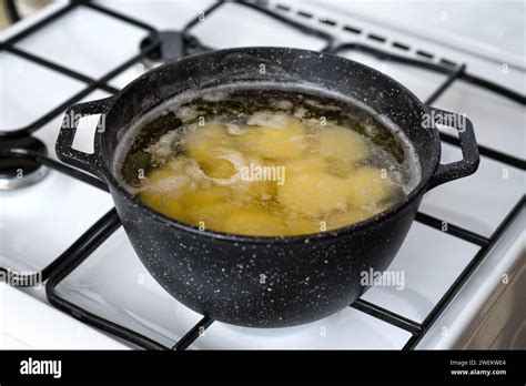 Cooking Halved Potato In A Pot With Boiling Water On A Gas Stove Stock