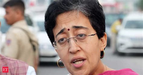 Bungalow Row Aap Shares Pics Of Delhi Cm Atishi Working Amid Packed