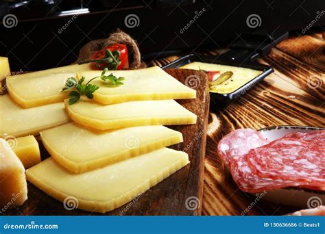 Delicious Traditional Swiss Melted Raclette Cheese Served in Ind Stock ...