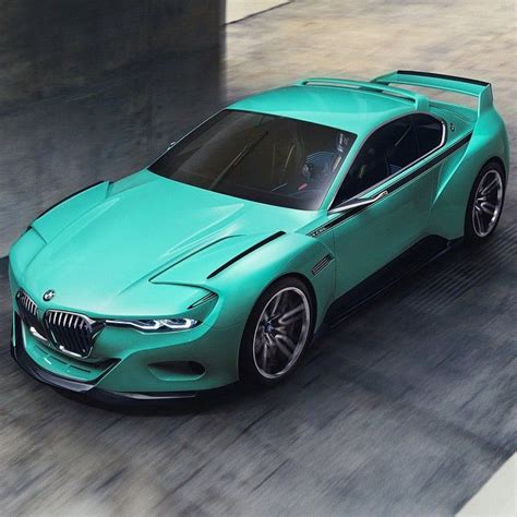 a green bmw concept car driving down the road