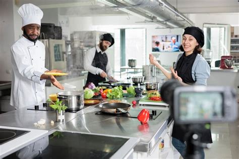 Premium Photo Smiling Chefs Preparing Food In Commercial Kitchen