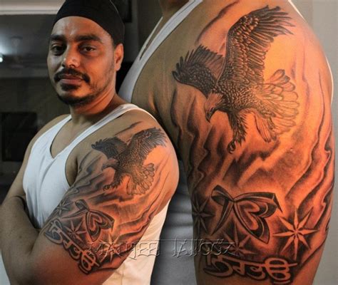 Eagle with ik onkar and nirbhau Tattoo - Manjeet Tattooz