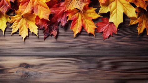 Premium AI Image | Fall Leaves Bordering a Wooden Fence Thanksgiving