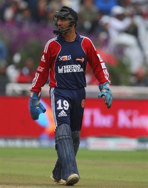 Dinesh Karthik shows off a baseball-type helmet | ESPNcricinfo.com