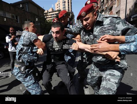 Police Officers Detain A Demonstrator During A Protest Against Prime