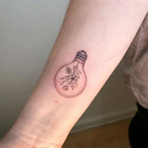 Light Bulb And Flowers Tattoo On The Inner Forearm