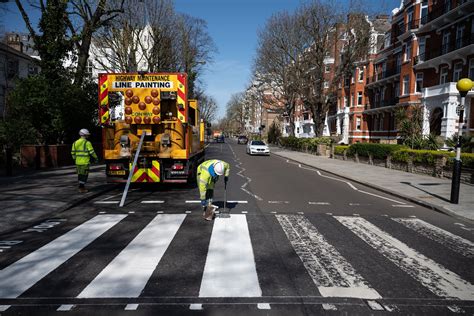 Beatles' Abbey Road crossing repainted during London lockdown - Lonely ...