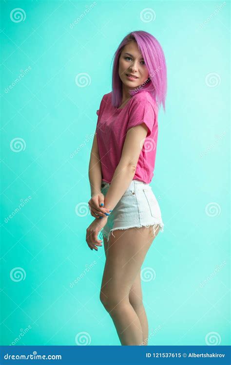 Slim Fit Sporty Active Woman In Denim Shorts Looking At Camera Isolated