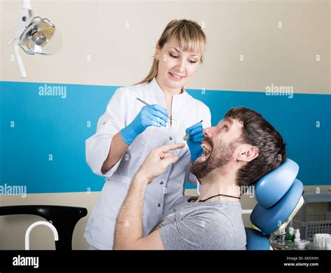 Doctor Examines The Oral Cavity On Tooth Decay Caries Protection