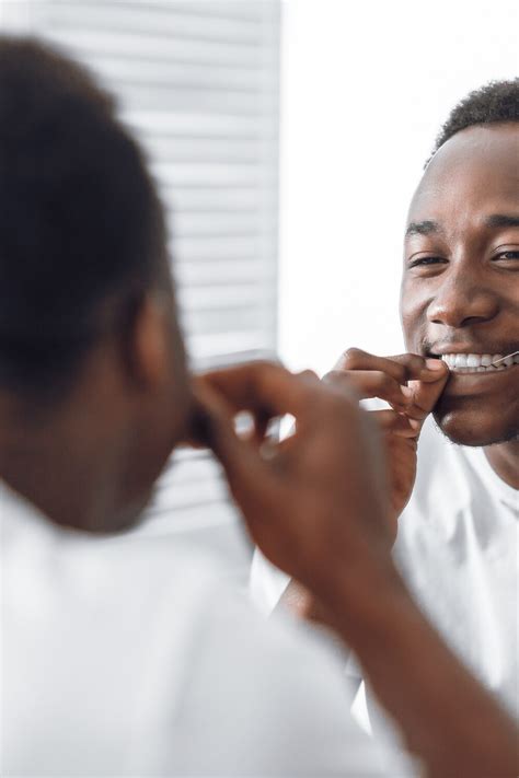 The Best Way To Floss With A Permanent Retainer