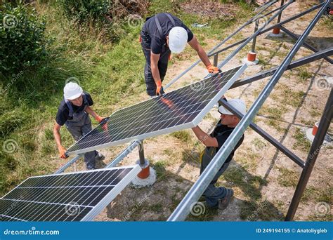 Workers Installing Solar Panel On Metal Beams Stock Image Image Of