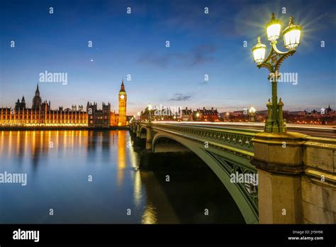 Night View Of Palace Of Westminster And Big Ben Reflecting On Thames