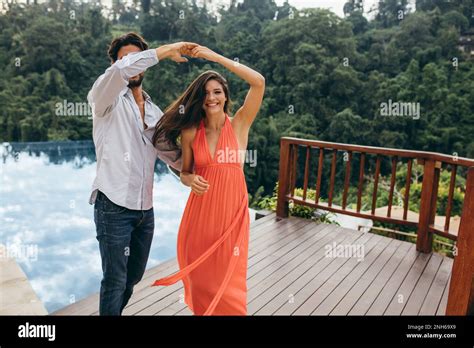 Portrait Of Man And Woman In Love Dancing Near Swimming Pool Couple