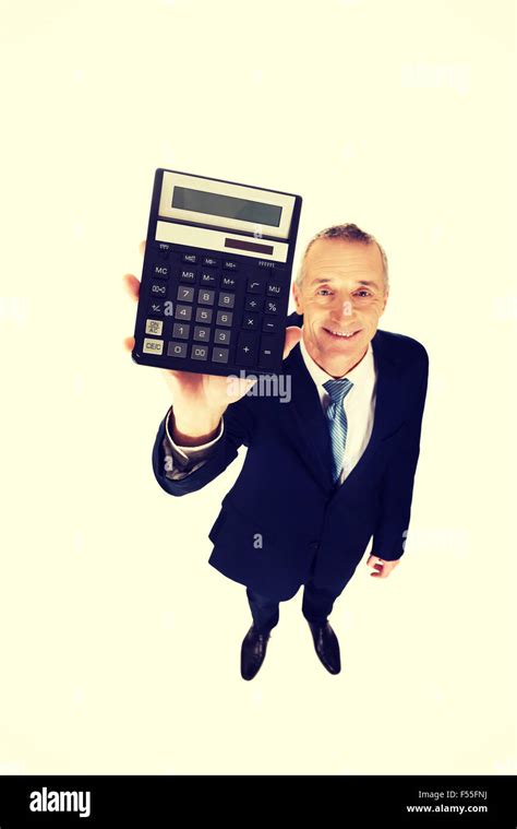 Happy Businessman Holding A Calculator Stock Photo Alamy