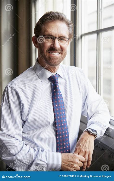 Senior White Businessman Smiling To Camera Vertical Stock Image