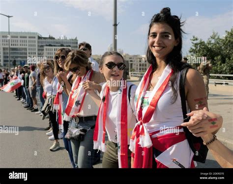 Lebanese People Hold Hands As They Form A Human Chain That Stretched