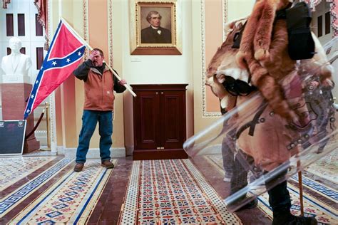 Capitol Riot Investigation Man Who Carried Confederate Flag Arrested The New York Times