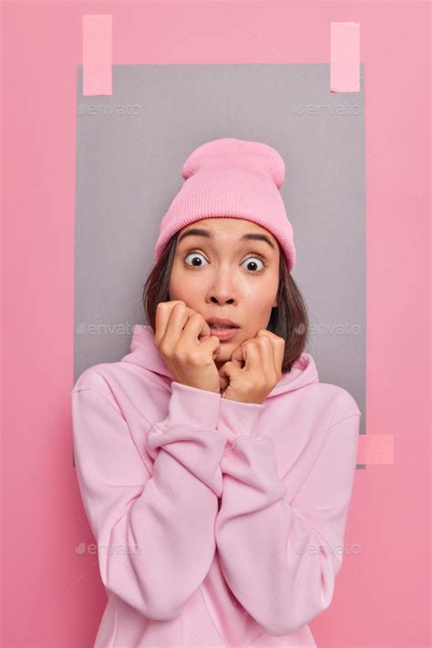 Anxious Scared Nervous Asian Woman Stares With Frightened Expression