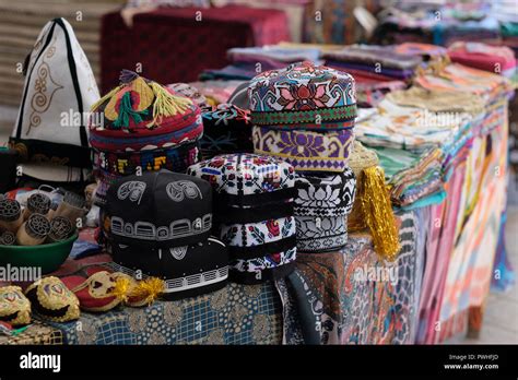 Traditional Uzbek doppa or duppi caps made with white embroidery with ...