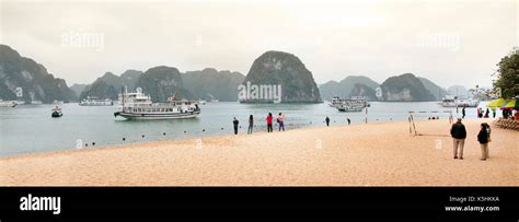 Titov Island Halong Bay Vietnam Beach Scene With Tourists And Tour