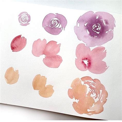 Watercolor Flowers On White Paper With Pinks And Oranges In The Middle One